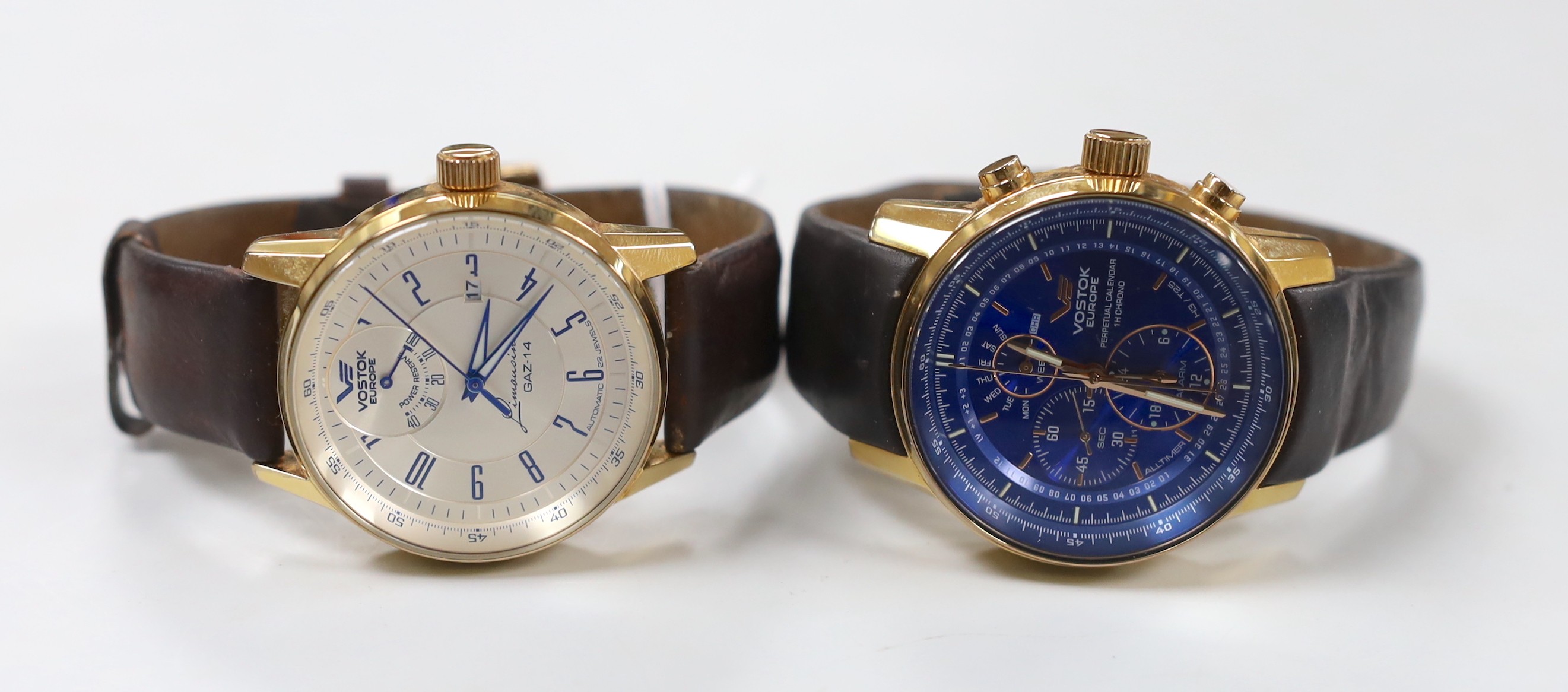 A gentleman's modern gilt metal Vostok Europe Perpetual Calendar wrist watch and a similar Limousine Gaz-4 wrist watch.